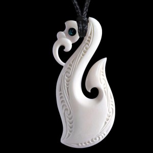 large hand crafted Manaia with Matau and Koru bone carving necklace